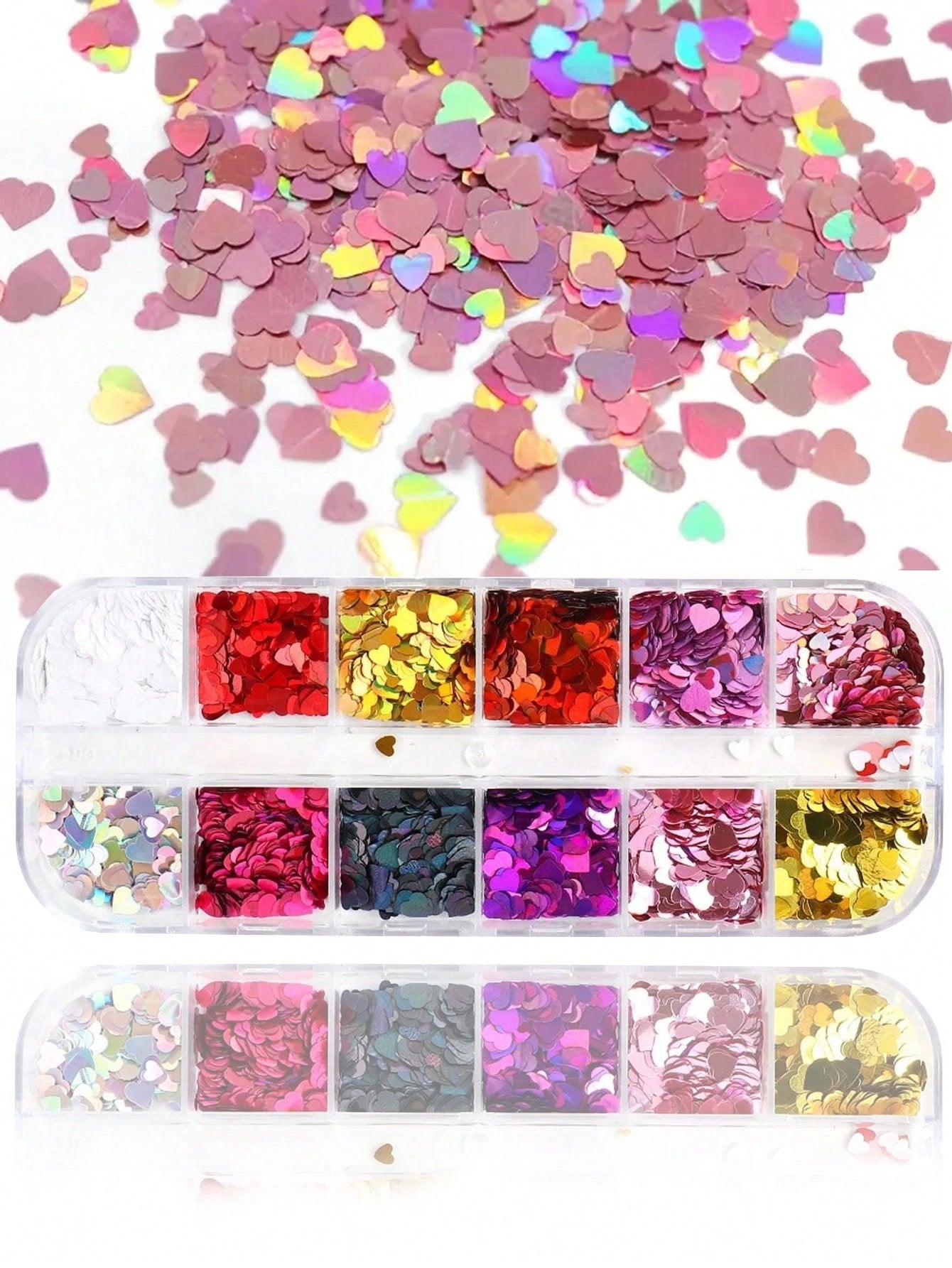 Heart-shaped nail art glitter confetti in a clear plastic tray, with loose multicolor heart confetti scattered above on a white background.