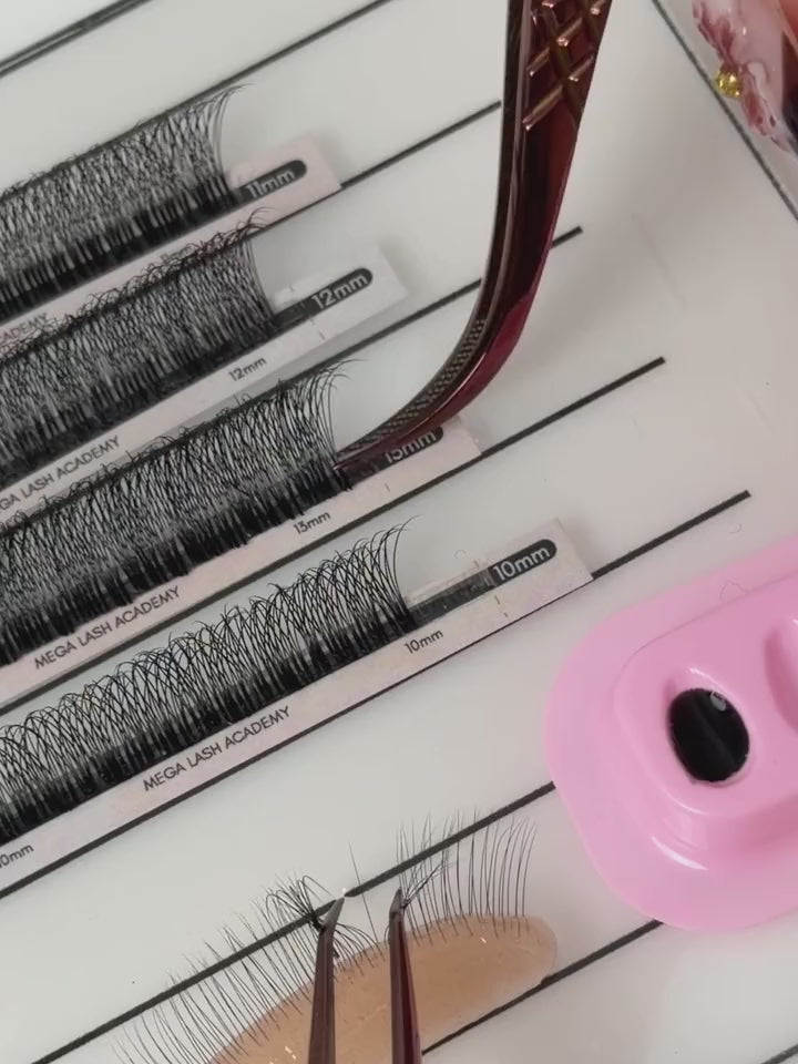 Lash artist picks up a Velo Fan with tweezers, dips it in adhesive, and places it in one smooth motion